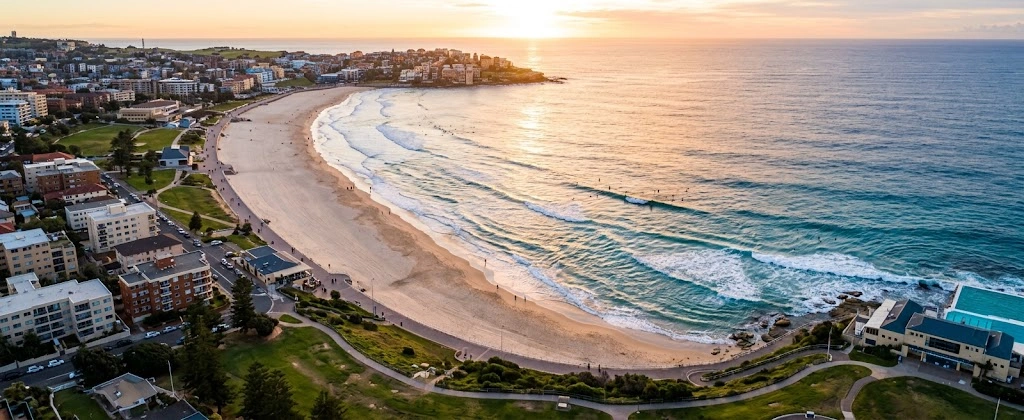 Curve of Bondi Beach from above in early morning light
