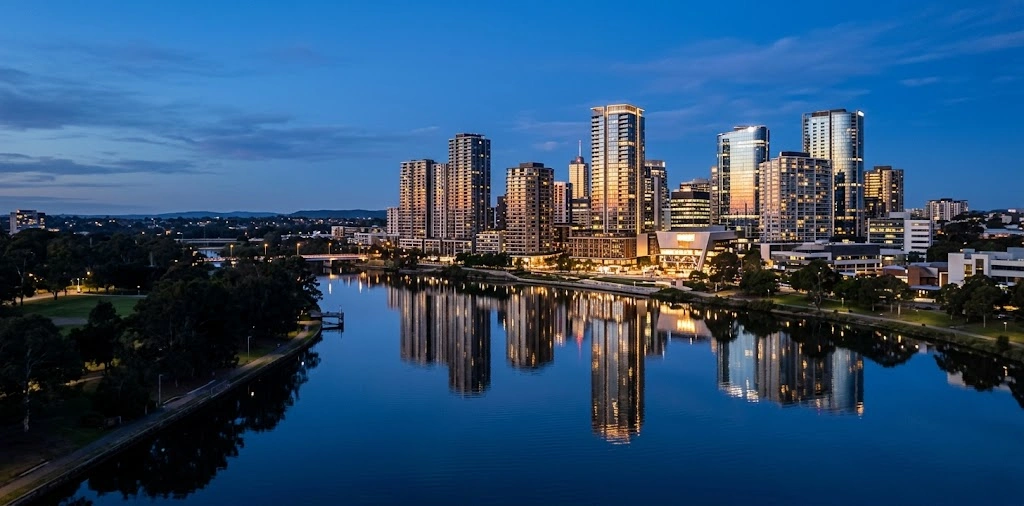 Parramatta city skyline and towers reflected in the river at blue hour