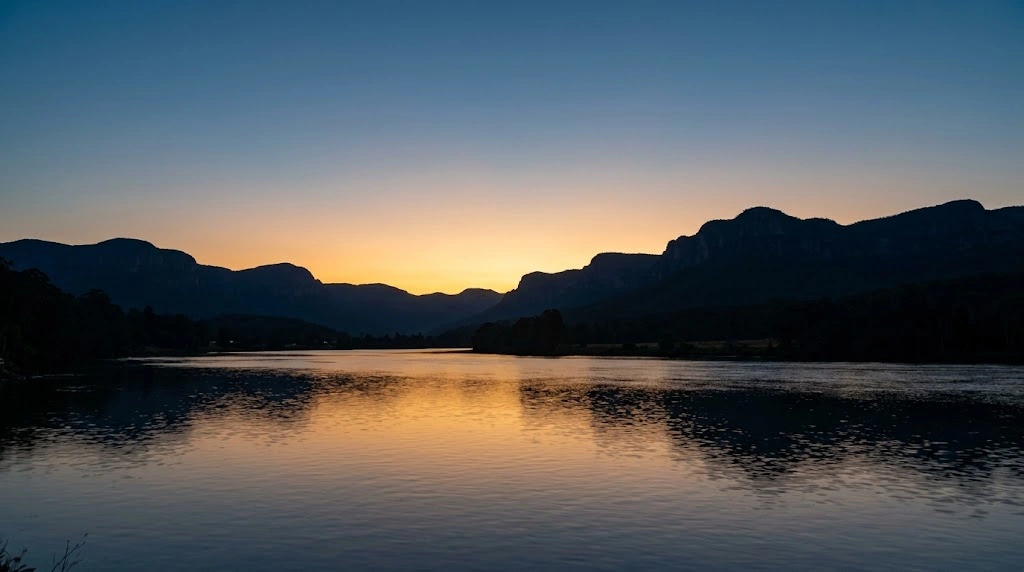 Dusk over the Nepean river with mountain silhouette
