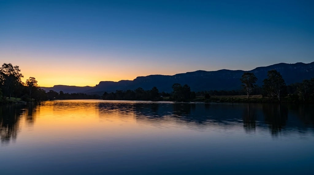 Dusk over the Nepean river with mountain silhouette
